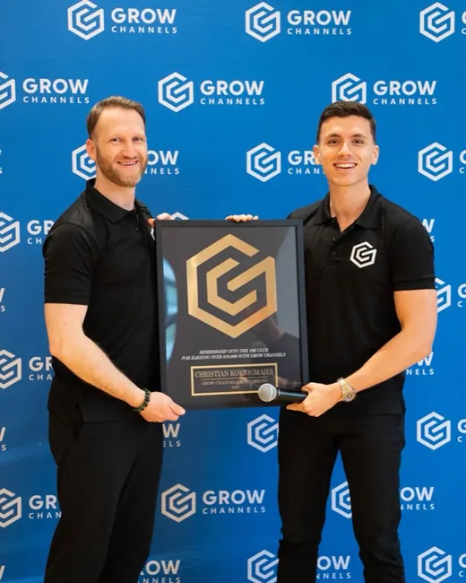 Christian Koenigmaier holding their 10K Club plaque